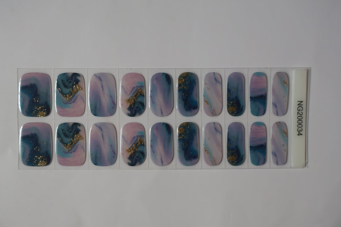 Close up of Lavender Dream semi-cured gel nail stickers sheet with multiple sizes in pastel purple tones