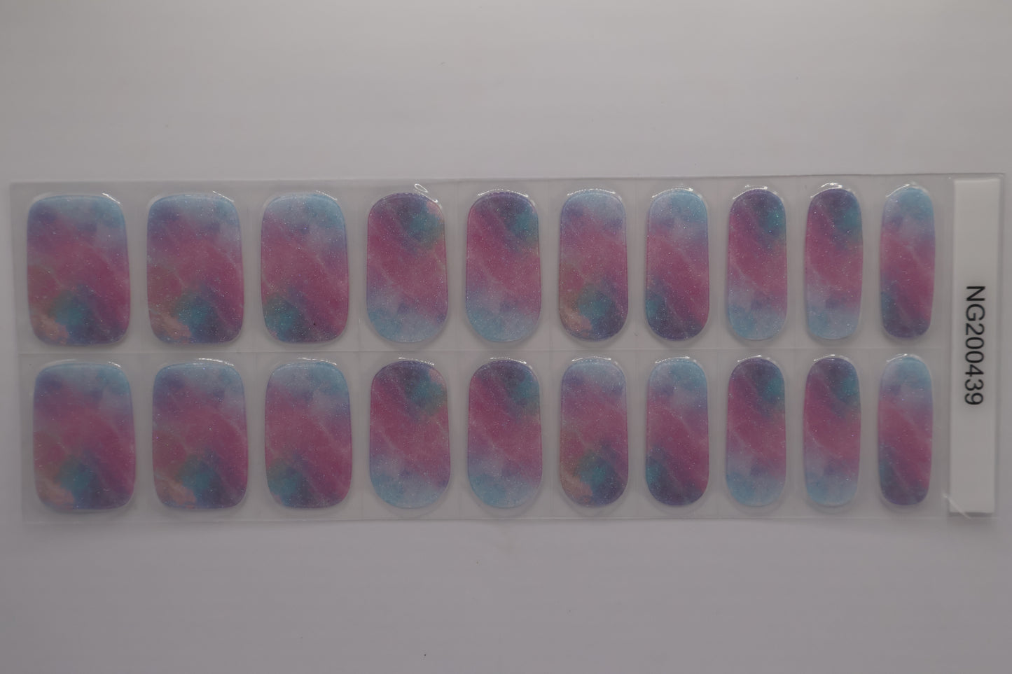Close up of Floral gel nail stickers sheet with pink and blue tones and multiple sizes