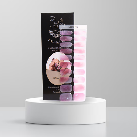 Cosmic Bloom semi-cured gel nail stickers in pink and purple with shimmer and Love Thy Nails packaging